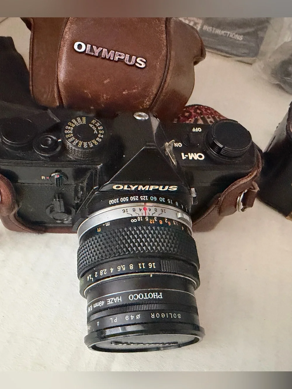 Olympus OM 1 SLR film camera with Original Leather  Case and Accessories